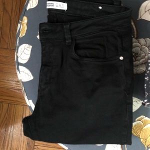Black skinny jeans, low to mid rise